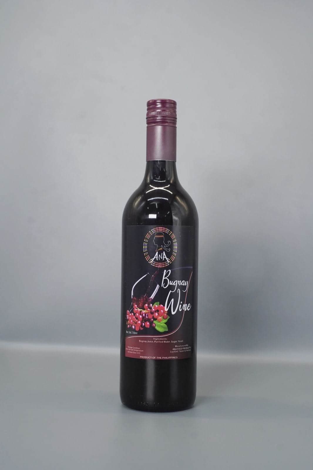 Bottle of ANA Bugnay Wine on a grey studio background